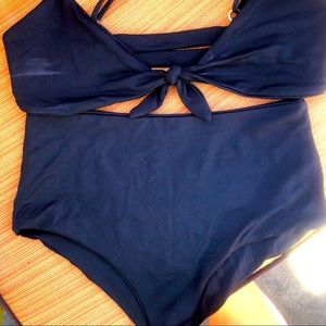 Black high waisted bottoms and tie top